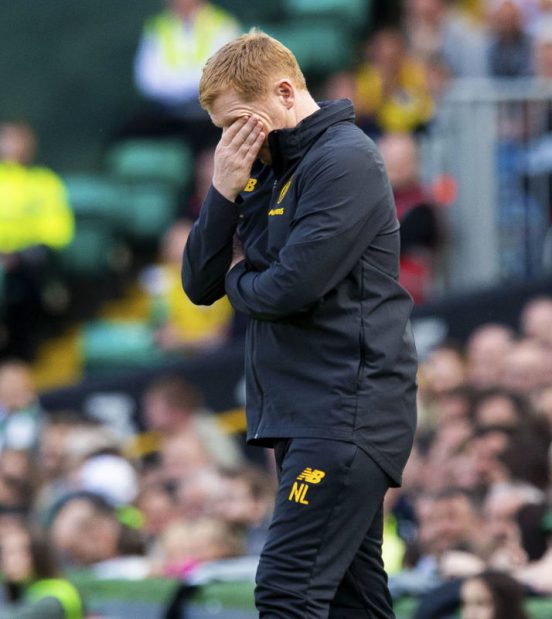 Neil Lennon looking dejected after Celtic suffered Champions League heartache 