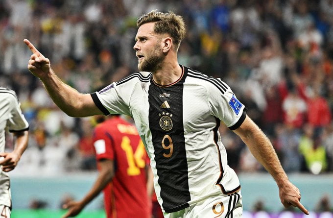 Germany snatch point from Spain but last 16 fate out of their hands